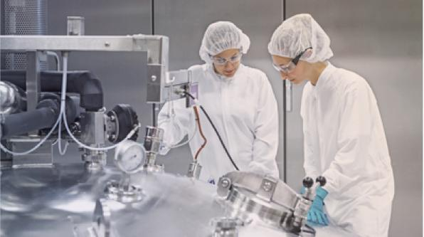 two scientists discussing a topic